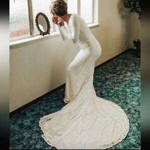 Rebecca Ingram Lace white wedding dress full length with train and bustle